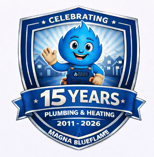 A blue shield-shaped badge with a smiling flame mascot, text reads Celebrating 15 Years Plumbing & Heating 2011-2026 Magna Blueflame, marking our incredible journey, with houses in the background.